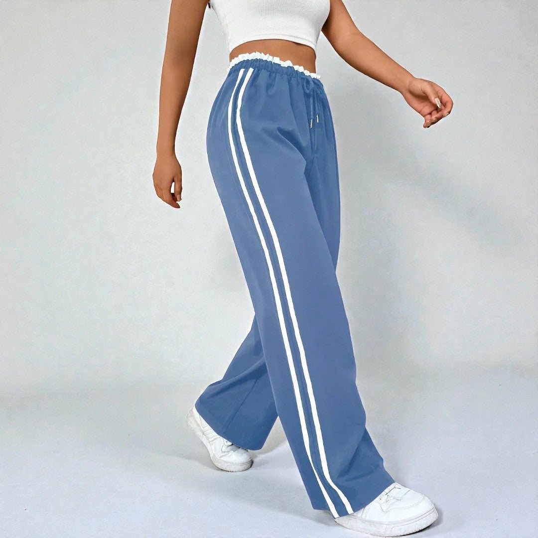 Damskie spodnie dresowe z prostą nogawką i podwójnymi lampasami - Błękitny