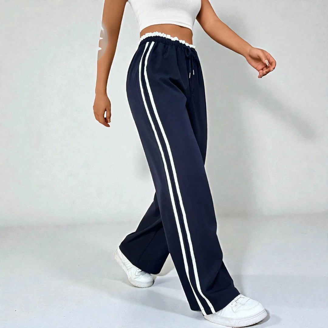 Damskie spodnie dresowe z prostą nogawką i podwójnymi lampasami - Granatowy